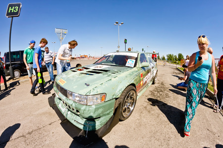 VOLGOGRAD - JUNE 6: The audience drift show with interest in visiting powerful cars designed specifically for drifting. June 6, 2015 in Volgograd, Russia.のeditorial素材