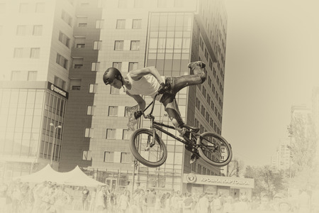 VOLGOGRAD - MAY 24: The BMX cyclist performs a stunt jump. The fifth annual competition for the Cup of Europe city Mall . May 24, 2015 in Volgograd, Russia.のeditorial素材