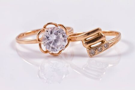 different a gold ring lying next to each otherの写真素材