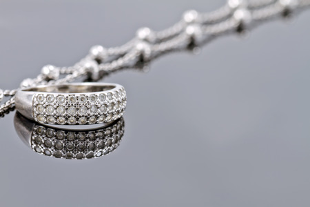 engagement silver ring with precious stones and fine silver chainの写真素材