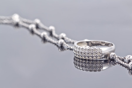 engagement silver ring with precious stones and fine silver chainの写真素材