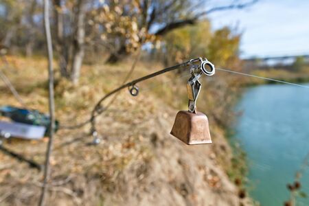 Brass bell for alarm strike on a hanging spinningの写真素材