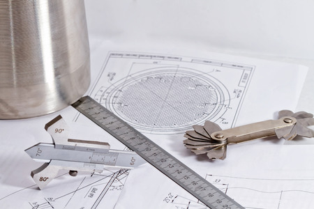 Templates for measuring the bevel edge during the preparation of the welded joints, measuring the height of the reinforcement bead and fillet weld leg are on the detail drawingの写真素材