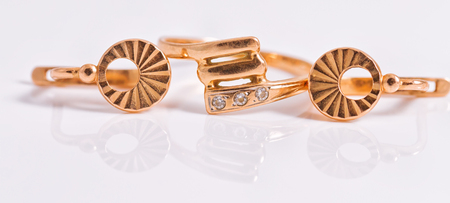 Elegant gold earrings and a ring from the same setの写真素材
