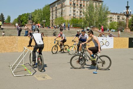 VOLGOGRAD - MAY 4: Young guys playing bike Polo on asphalt upper terrace of the Central embankment. May 4, 2014 in Volgograd, Russia.のeditorial素材