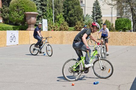 VOLGOGRAD - MAY 4: Young guys playing bike Polo on asphalt upper terrace of the Central embankment. May 4, 2014 in Volgograd, Russia.のeditorial素材