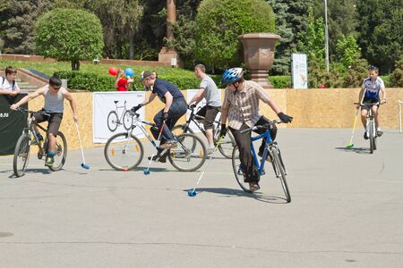 VOLGOGRAD - MAY 4: Young guys playing bike Polo on asphalt upper terrace of the Central embankment. May 4, 2014 in Volgograd, Russia.のeditorial素材
