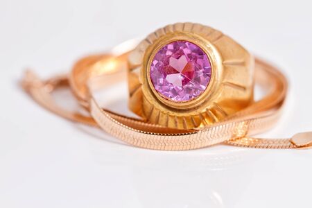 Elegant gold chain and gold ring with rubyの写真素材