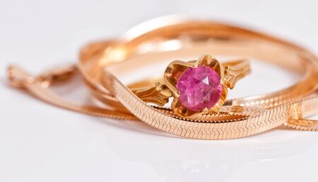 Elegant gold chain and gold ring with rubyの写真素材
