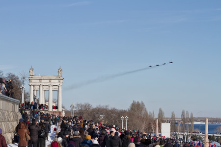 VOLGOGRAD - JANUARY 30: A large number of people came to the Central promenade to see the parade of military aviation. January 30, 2016 in Volgograd, Russia.のeditorial素材