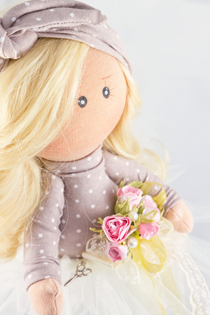 Souvenir handmade doll with natural hair in polka dot dressの写真素材