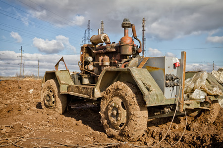 The old Soviet diesel plant to generate electricity in the field is in the dirtの写真素材