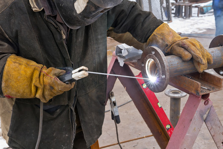 Flat welding flange to the pipe steel by a method of manual arc weldingの写真素材