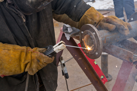 Flat welding flange to the pipe steel by a method of manual arc weldingの写真素材