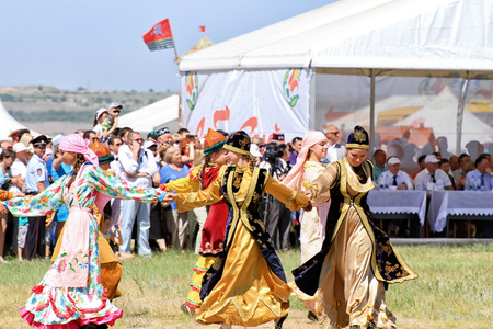SMALL CHAPURNIKI, VOLGOGRAD, RUSSIA - MAY 24: Young  girls dressed in traditional costumes dancing folk dances at the celebration of the Sabantuy. May 24, 2014 in Volgograd, Russia.のeditorial素材