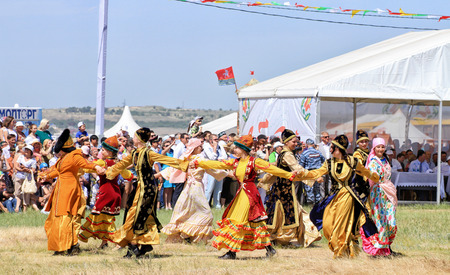 SMALL CHAPURNIKI, VOLGOGRAD, RUSSIA - MAY 24: Young  girls dressed in traditional costumes dancing folk dances at the celebration of the Sabantuy. May 24, 2014 in Volgograd, Russia.のeditorial素材