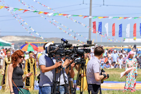 SMALL CHAPURNIKI, VOLGOGRAD, RUSSIA - MAY 24: Journalists with cameras and video cameras at the all-Russian rural Sabantuy. May 24, 2014 in Volgograd, Russia.のeditorial素材