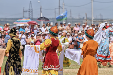 SMALL CHAPURNIKI, VOLGOGRAD, RUSSIA - MAY 24: Young  girls dressed in traditional costumes dancing folk dances at the celebration of the Sabantuy. May 24, 2014 in Volgograd, Russia.のeditorial素材