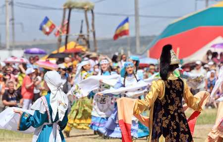 SMALL CHAPURNIKI, VOLGOGRAD, RUSSIA - MAY 24: Young girls dressed in traditional costumes dancing folk dances at the celebration of the Sabantuy. May 24, 2014 in Volgograd, Russia.のeditorial素材