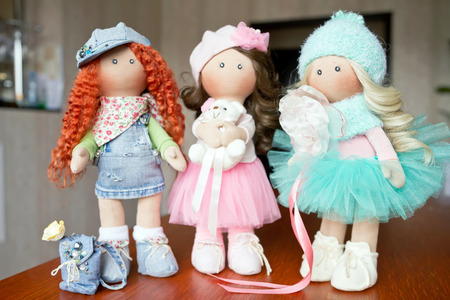 Three rag doll textile handmade with natural hairの写真素材
