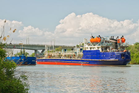 VOLGOGRAD - MAY 22: Two barges with oil floating towards each other in the Volga-don navigable channell. May 22, 2016 in Volgograd, Russia.のeditorial素材