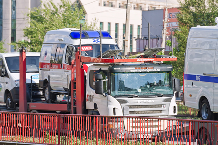 VOLGOGRAD - MAY 22:Transportation new cars of emergency services of ambulance and police cars on the trucks. May 22, 2016 in Volgograd, Russia.のeditorial素材