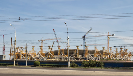 VOLGOGRAD, RUSSIA - AUGUST 22: Construction works on erection of steel structures of the stadium "Victory" for the world Cup 2018. August 22, 2016 in Volgograd, Russia.のeditorial素材