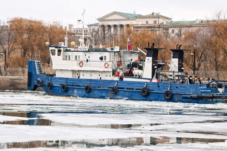 VOLGOGRAD, RUSSIA - NOVEMBER 27: River tug floats on the navigable channel is already fettered by ice. November 27, 2016 in Volgograd, Russia.のeditorial素材