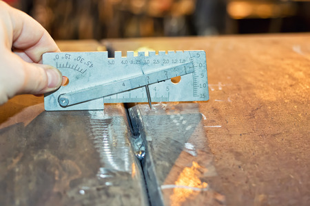 Checking geometric parameters of jointing of two pipes of large diameter by means of the universal template welderの写真素材