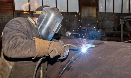 Welding large diameter pipe in workshop conditions by the method of semi-automatic welding in shielding gasesの写真素材
