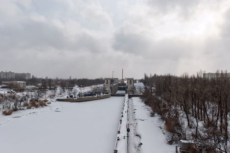 VOLGOGRAD - JANUARY 29: Repairs airlock sluice navigation canal are conducted in winter in the snow. January 29, 2017 in Volgograd, Russia.のeditorial素材
