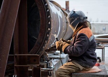 Repair work on welded flange large chemical apparatus by manual arc welding with consumable...
