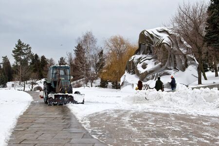 VOLGOGRAD - FEBRUARY 5:Snow removal after a snowfall the memorial complex Mamaev Kurgan with a special tractor. February 5, 2017 in Volgograd, Russia.のeditorial素材
