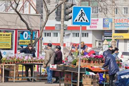 VOLGOGRAD - MARCH 5: Selling flowers on the streets on the eve of international women's day. March 5, 2017 in Volgograd, Russia.のeditorial素材