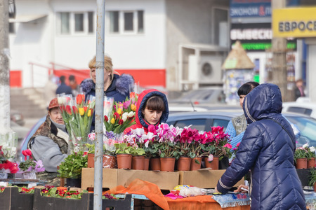 VOLGOGRAD - MARCH 5: Selling flowers on the streets on the eve of international women's day. March 5, 2017 in Volgograd, Russia.のeditorial素材
