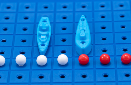 Toy war ship and submarine with missiles from Board games are in the imaginary Maritime boundaryの写真素材