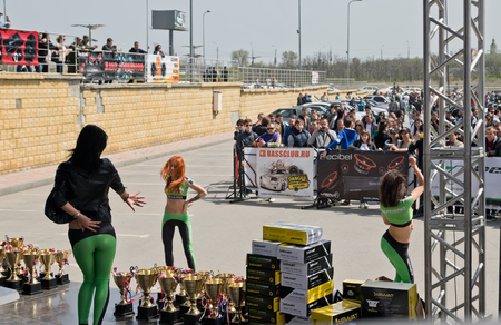 VOLGOGRAD, RUSSIA - APRIL 29:Beautiful girl dancer of the support group perform in tight-fitting clothes on stage competitions tuning and car audio. April 29, 2017  in Volgograd, Russia.のeditorial素材