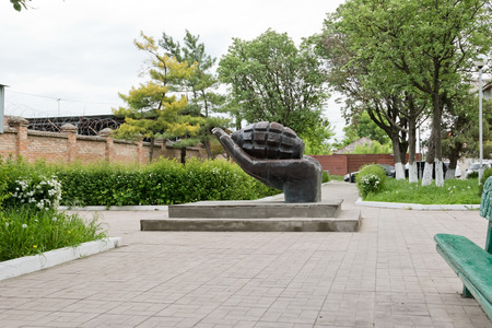 MOZDOK, RUSSIA - MAY 9: The monument in the form of grenades lying on the palm in memory of those dead during the Chechen campaign. May 9, 2017  in  North Ossetia-Alania, Mozdok, Russiaのeditorial素材