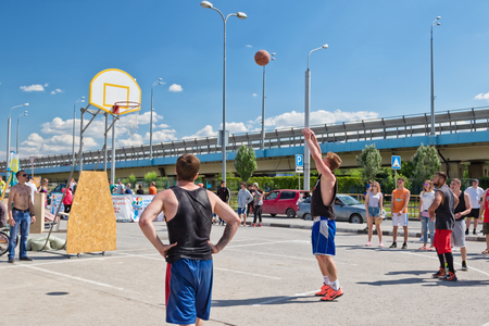 VOLGOGRAD - MAY 27: Open street streetball competitions. The striker performs a free shot . May 27, 2017 in Volgograd, Russia.のeditorial素材