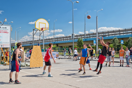 VOLGOGRAD, RUSSIA - MAY 27: Unidentified young people play in streetball on the open area located next to the "dancing" bridge. May 27, 2017 in Volgograd, Russia.のeditorial素材
