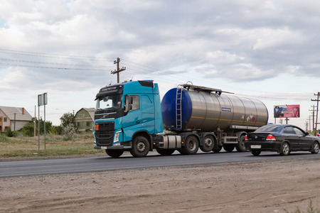 VOLGOGRAD - JULY 30: A truck hauling a fuel tanker on bypass road. July 22, 2016 in Volgograd, Russia.のeditorial素材
