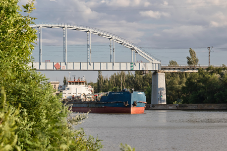 VOLGOGRAD - JULY 30: Transportation of goods and petroleum products on barges on the Volga-don shipping canal. July 30, 2016 in Volgograd, Russia.のeditorial素材