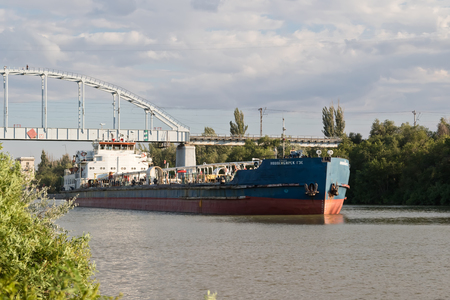 VOLGOGRAD - JULY 30: Transportation of goods and petroleum products on barges on the Volga-don shipping canal. July 30, 2016 in Volgograd, Russia.のeditorial素材