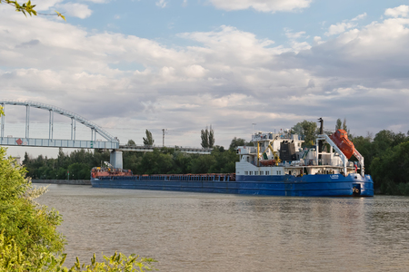 VOLGOGRAD - MAY 22: Transportation of goods and petroleum products on barges on the Volga-don shipping canal. May 22, 2016 in Volgograd, Russia.のeditorial素材