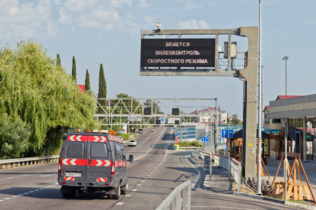 SOCHI, RUSSIA - AUGUST 11: A large electronic scoreboard with a warning about doing video recording speed mode is installed on the new motorway . August 11, 2017  in Sochi, Russia.のeditorial素材