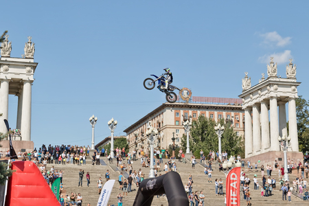 VOLGOGRAD - SEPTEMBER 9: Tricks on a motorcycle jump performed by the athletes during the first championship of Russia on freestyle motocross. September 29 2017 in Volgograd Russia.のeditorial素材