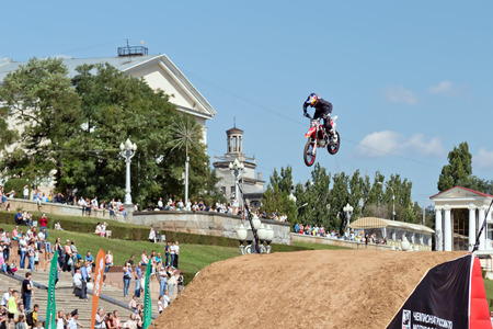 VOLGOGRAD - SEPTEMBER 9: Tricks on a motorcycle jump performed by the athletes during the first championship of Russia on freestyle motocross. September 29 2017 in Volgograd Russia.のeditorial素材