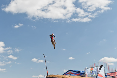 VOLGOGRAD - SEPTEMBER 9: Tricks on a motorcycle jump performed by the athletes during the first championship of Russia on freestyle motocross. September 29 2017 in Volgograd Russia.のeditorial素材