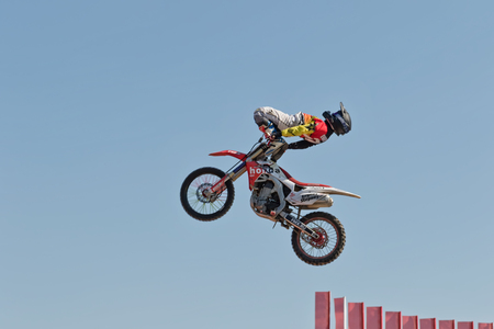 VOLGOGRAD - SEPTEMBER 9: Tricks on a motorcycle jump performed by the athletes during the first championship of Russia on freestyle motocross. September 29 2017 in Volgograd Russia.のeditorial素材