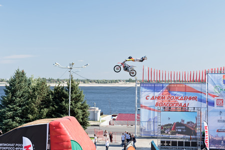 VOLGOGRAD - SEPTEMBER 9: Tricks on a motorcycle jump performed by the athletes during the first championship of Russia on freestyle motocross. September 29 2017 in Volgograd Russia.のeditorial素材